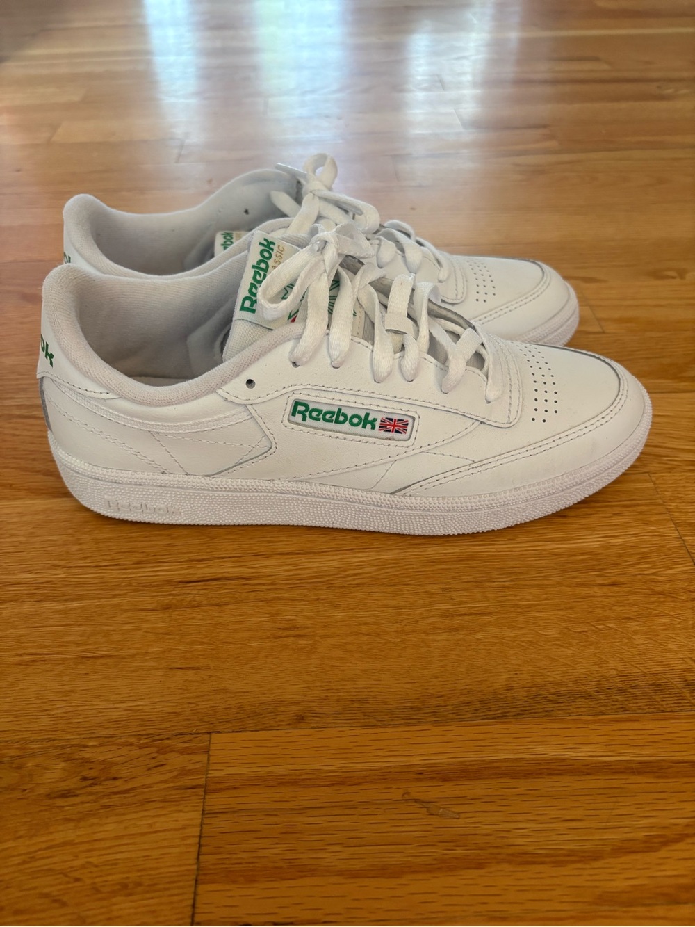 Reebok women’s  White Sneakers with Green Logo